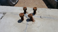 Photo 3 - For misaligned or bent anchor bolts that will not allow the base plate to fit over the bolts, consider bending the bolts into position.